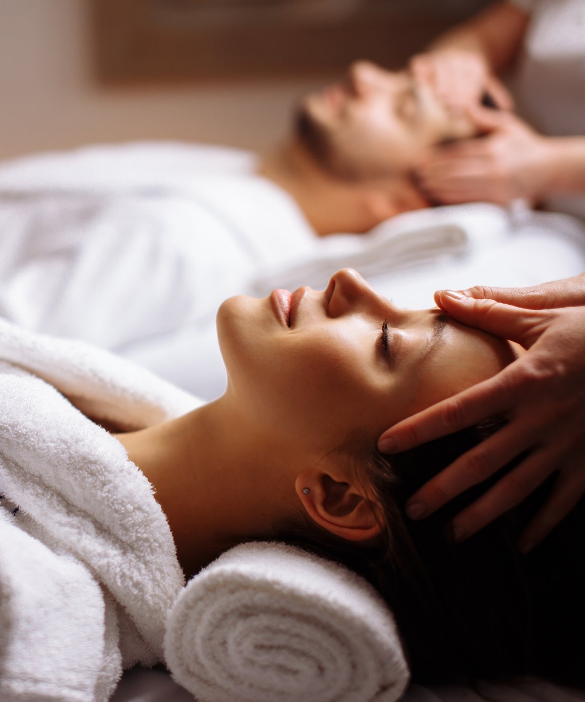 Couple's spa massage in white robes